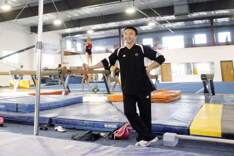 Years after abuse reports, ex-coach at renowned US gymnastics academy is arrested by FBI